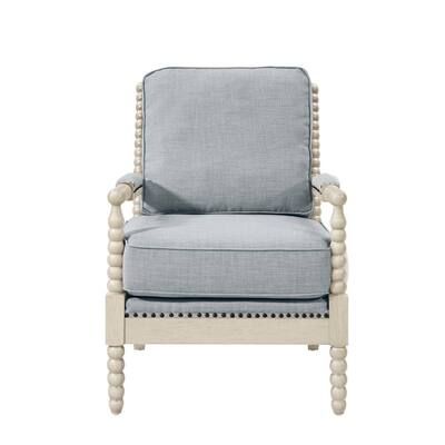 an upholstered chair with buttons on the back and arms, in light blue fabric