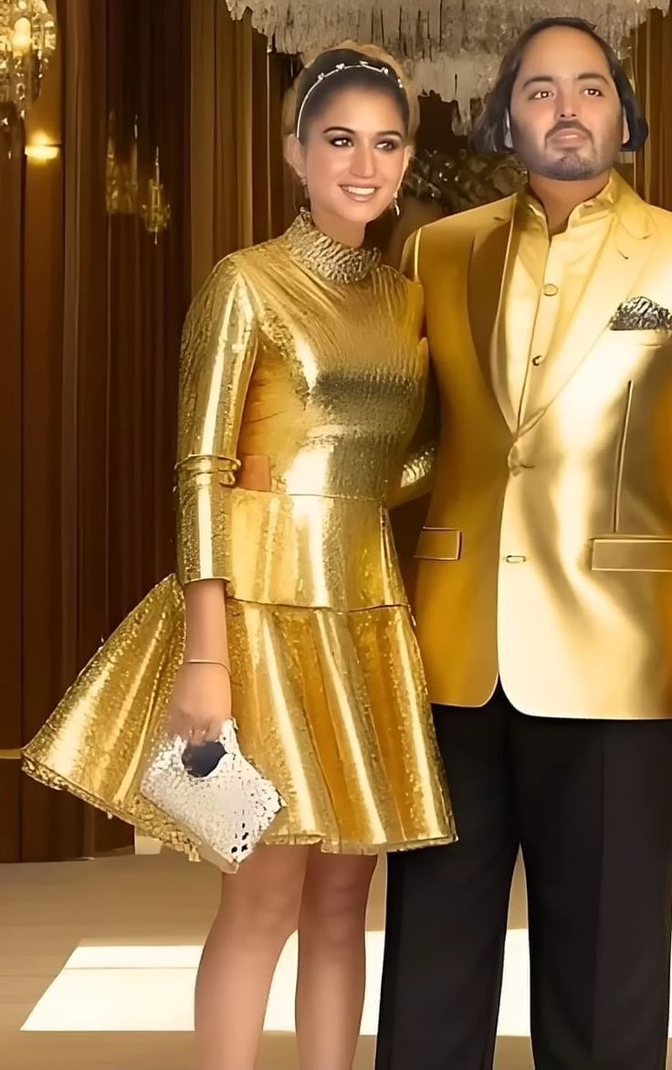 the man and woman are dressed in gold