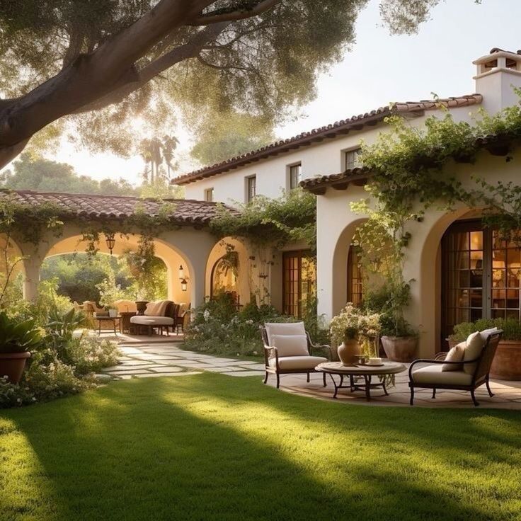 an outdoor living area with chairs and tables