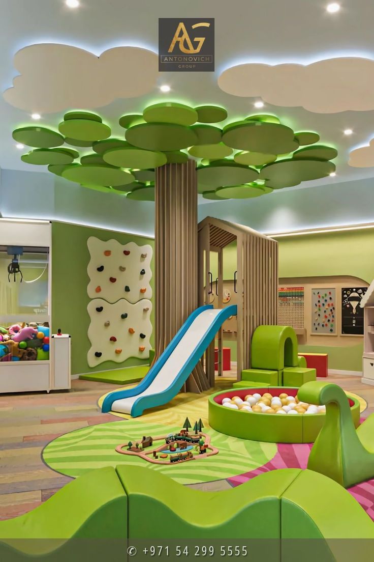 the children's playroom is decorated in green and white colors with a slide