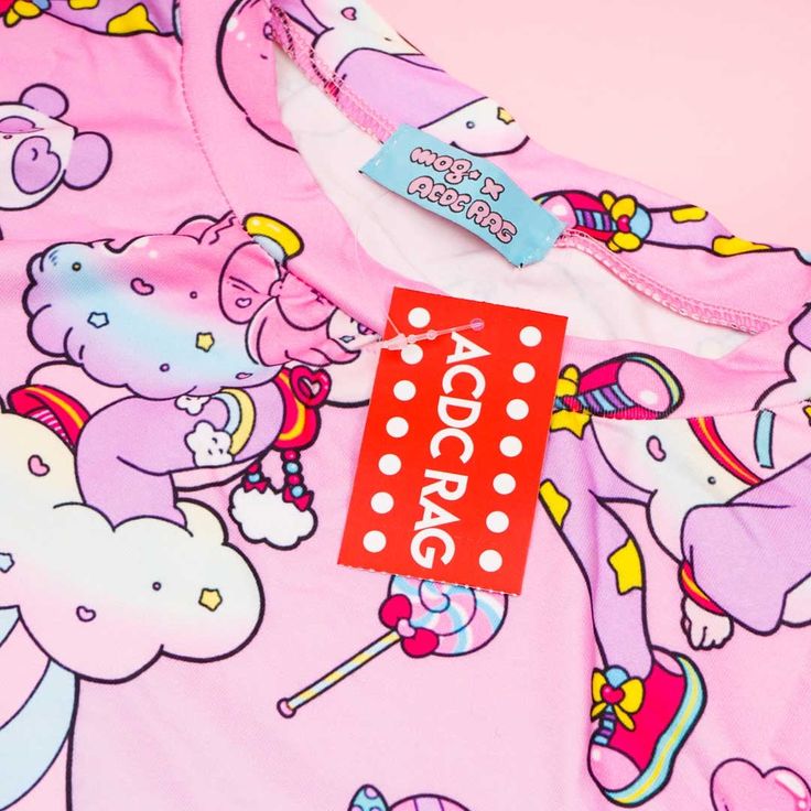 Brighten up your mood by wearing this super cute tee with a print of a pastel pop animé girt called “Fuwa-chan!” This Harajuku-inspired brand gets its fashion aesthetic from the colorful streets of Takeshita! The design itself is a collab with a Japanese animator named “mog.” A kawaii t-shirt decorated with a pastel illustration of Fuwa-chan Features a collaboration with Japanese animator named mog Made of soft polyester material Length: approx. 70 cm / 27.56 inches Shoulder width: approx. 52 cm Harajuku Style Graphic Print Tops, Pink Harajuku Style Anime Print T-shirt, Pink Harajuku T-shirt With Anime Print, Pink Kawaii Anime Print T-shirt, Kawaii Multicolor Character Print T-shirt, Kawaii Pink Tops With Graphic Print, Pastel Goth Cotton T-shirt With Graphic Print, Kawaii Multicolor Letter Print T-shirt, Cute Unicorn Print Summer T-shirt