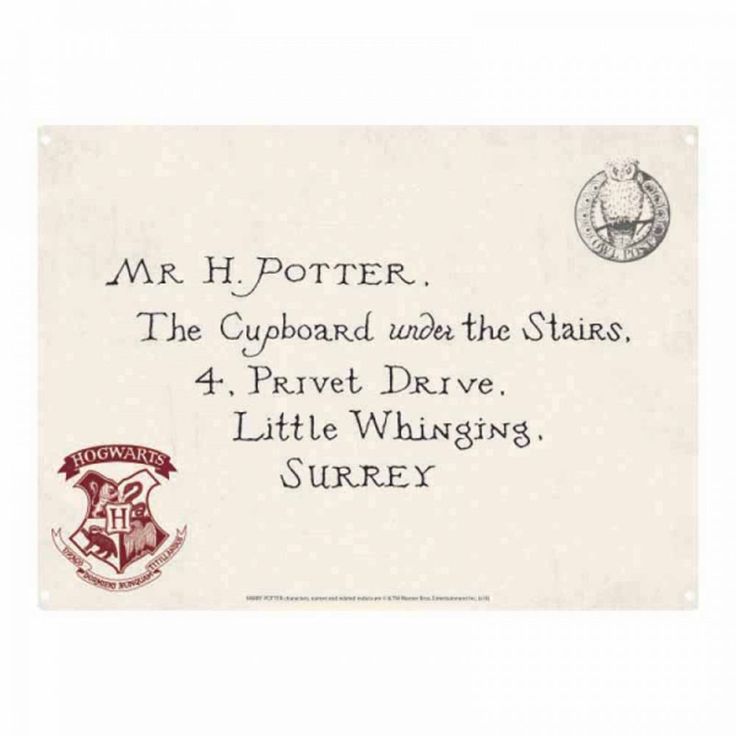 an old harry potter envelope with the hogwart's crest and motto on it