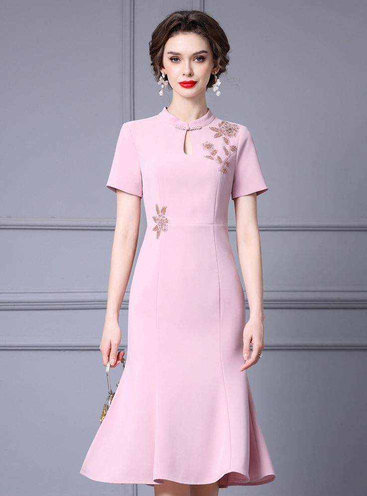 Loving the idea of a dress that blends elegance with modern details? This mother of the bride dress is the perfect choice. The soft pink hue is both refined and celebratory, ideal for making a memorable impression. This dress features a high neckline with a keyhole detail, embellished with delicate beadwork, adding a touch of glamour. The floral appliqu�� on the bodice provides a unique and feminine touch. Made from premium materials, this dress guarantees a comfortable fit and fluid movement, perfect for mingling and dancing. The tailored silhouette enhances your natural curves, providing a flattering and feminine look. Complete your outfit with statement accessories and a chic clutch to enhance the overall elegance. This dress is not just an outfit; it is a celebration of style and grace Wedding Day Dresses, Mermaid Shorts, Dress Puff Sleeve, Pink Mermaid, Vintage Gowns, Stunning Gowns, Mother Of The Bride Dress, Half Price, Gown Dress