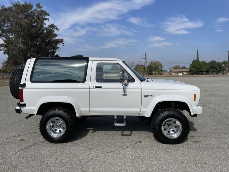 a white truck parked in a parking lot