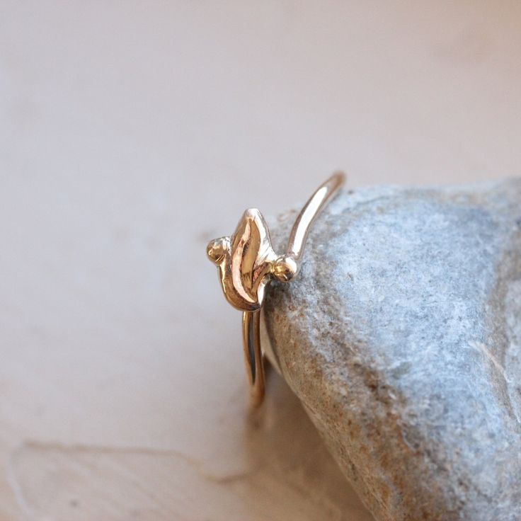 Gilded Foliole is a delicate art deco inspired leaf ring. The polished gold shimmers so beautifully. The perfect promise ring? I fabricated this design from 14k yellow gold in my studio. Size 6 or 52 or 16.5 or L 1/2 (can be sized) nangijalajewelry.etsy.com Dainty Hand Forged Gold Stackable Rings, Delicate Gold Stackable Rings With Rose Cut Diamonds, Gold Handcrafted Stackable Rings, Dainty 14k Rose Gold Stackable Rings, Elegant Marquise Cut Gold Jewelry, Elegant Adjustable Stackable Rings Stamped 14k, 14k Yellow Gold Leaf-shaped Jewelry, Delicate Gold Stackable Rings, Elegant Gold Hand Forged Stackable Rings