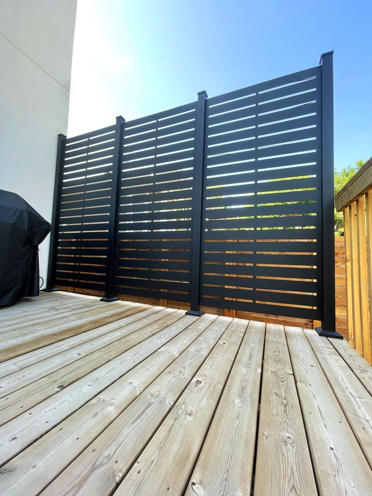 a wooden deck with black slats on it