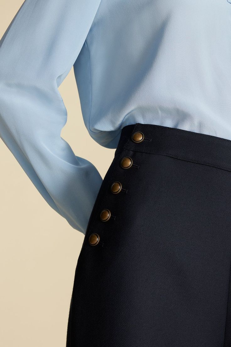 The Sailor Wide Leg Trousers are the epitome of low-key cool. Sitting high on the waist, they're fitted with button accents along the angled seams and a playful nod to traditional mariner style. DESIGN- Classic fit. Choose your usual size.- A wide-leg trouser, fitted at the waist with buttons placed along the front seams.- Metal buttons- Rise: 12 1/2", Inseam: 28"FABRIC & CARE- 50% RWS Wool, 50% polyester- 100% recycled polyester lining- Ethically made in China.- Dry clean only.SUSTAINABILITY- This product is made of material certified by the Responsible Wool Standard (RWS), recycled materials, and other controlled sources.- The Responsible Wool Standard (RWS) aims to improve the welfare of sheep and the land they graze on. RWS farmers and ranchers are evaluated against animal welfare, lan The Sailor, Jumpsuit Skirt, Sweater Blazer, Denim Pant, Metal Buttons, Low Key, Wide Leg Trousers, Style Design, Skirt Pants