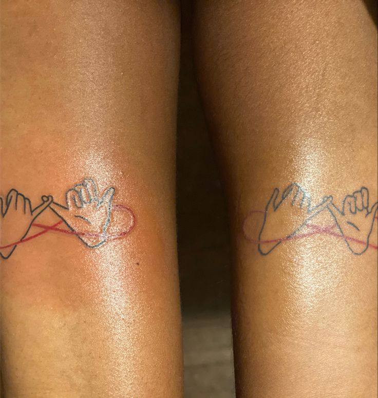 two people with matching tattoos on their legs