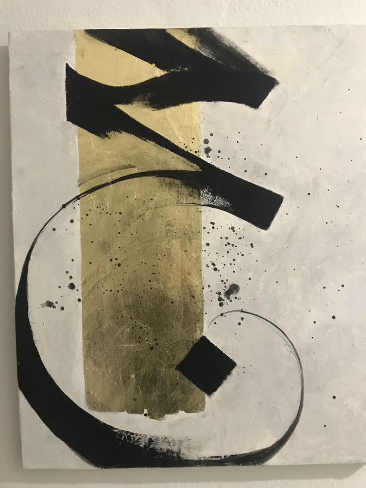 an abstract painting with black and gold paint on white paper, hanging on a wall