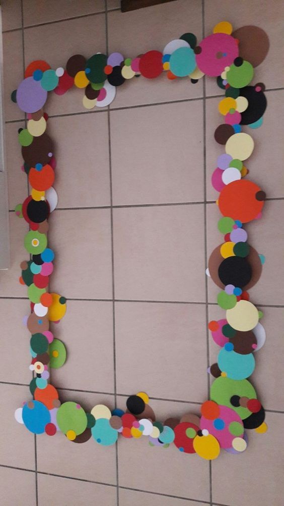 a bathroom wall decorated with paper circles