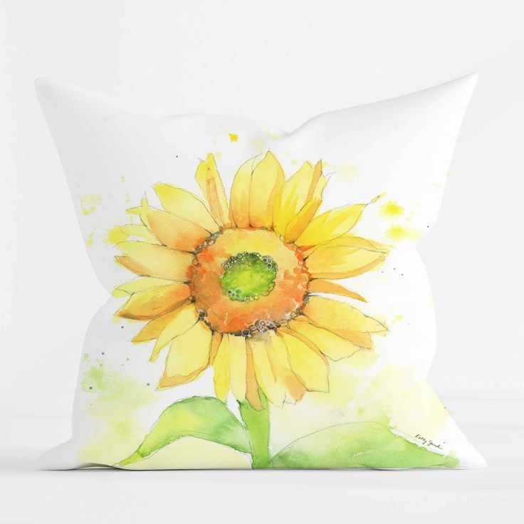 a yellow sunflower painted on a white pillow