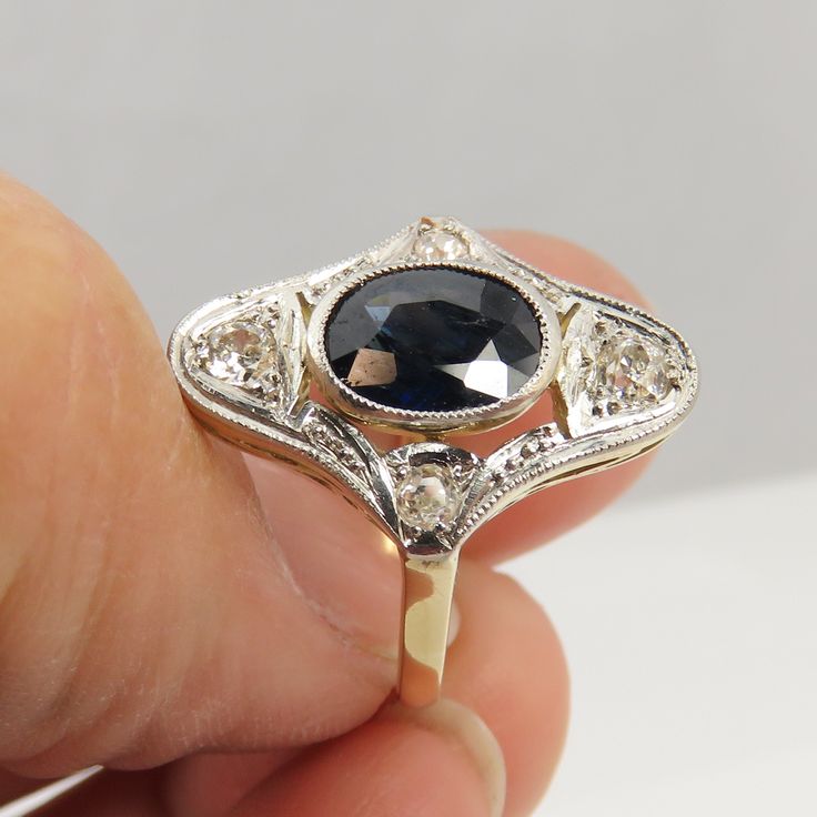 Estate 30's antique 14k and platinum top deep blue sapphire and diamond ring size 6.25. great shape. 4.6 grams. come with box that was at the estate. sapphire is 9mm by 7mm. 4 clean white diamons approx 4mm each. beautiful ring. ring is 19.7mm wide. Vintage White Gold Sapphire Ring With Polished Finish, Antique Blue Oval Diamond Ring, Heirloom Sapphire Ring With Diamond Cut For Collectible, Antique Blue Diamond Rings, Vintage Sapphire Diamond Formal Ring, Vintage Sapphire Diamond Ring For Formal Occasions, Vintage Sapphire Diamond Ring For Formal Events, Blue Art Deco Jewelry Stamped 14k, Antique 14k Sapphire Anniversary Ring