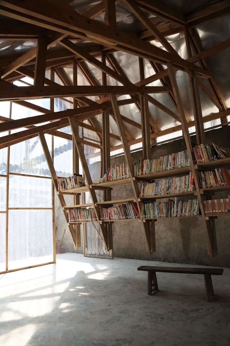 the bookshelf is made out of wooden beams