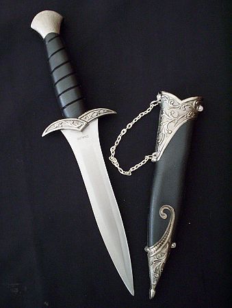 two different types of knifes with chains on them and one has a chain attached to it