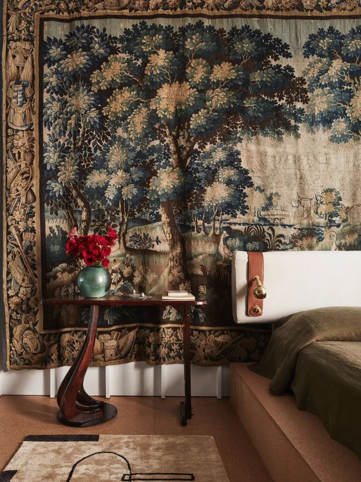 a bed room with a large tapestry on the wall