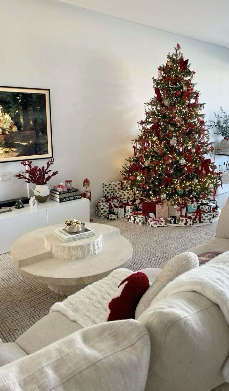 a living room with a christmas tree in the corner