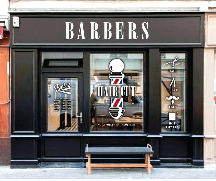 a barber's shop front with the door open