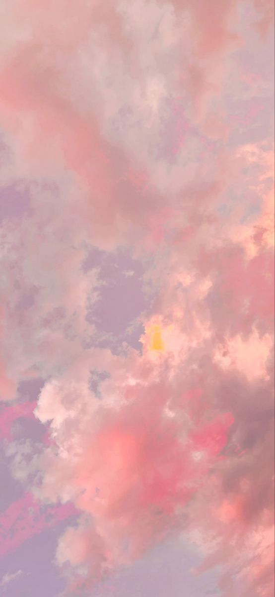 the sky is filled with pink clouds and yellow sun