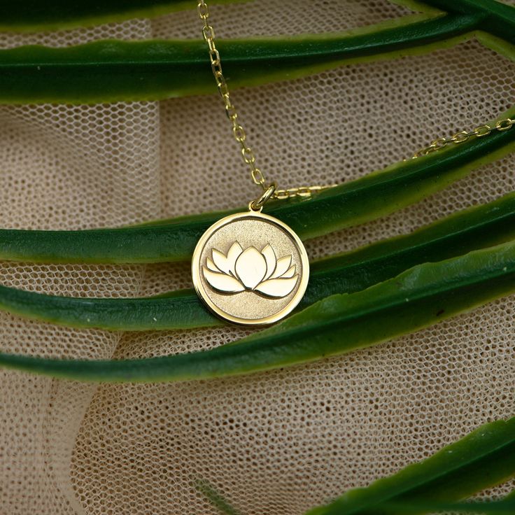 ♥ Material: Real Solid Gold - Not gold plated - Not gold filled ♥ Available gold karat: 14K (585) ♥ Photo size is 15.3mm / 0.60 inches  ♥ The pendant is available in 6 sizes: 12,7MM     / 0,50 INCHES 14,0 mm  / 0,55 INCHES 16,5 mm  / 0,65 INCHES 16,5 mm  / 0,65 INCHES 19,1 mm   / 0,75 INCHES 25,4 mm /  1      INCHES Real 14k Solid Gold Lotus Flower Necklace - Dainty Lotus Jewelry - Rose Gold Lotus Charm - Third Eye - Gift For Her - By Uluer Jewelry ♥ Material of chain: Solid gold 14k ( REAL GOLD ) It is thin and dainty and it is available in 6 sizes: - - 35 CM / 13,80 INCHES - 40 cm / 15,75 INCHES  - 45 cm / 17,72 INCHES  - 50 cm / 19,68 INCHES - 55 cm / 21,65 INCHES  - 60 cm / 23,62 INCHES ♥ The thickness of the pendant is: 0,50 mm ♥ Inner diameter of the jump ring: 3x3 mm ♥ Backside engr Gold Flower Jewelry For Jewelry Making, Gold Plated Flower Shaped Jewelry In Gold, Gold Plated Flower Jewelry In Gold Color, Gold Brass Jewelry In Flower Shape, Gold-plated Flower Jewelry In Gold, Rose Gold Brass Necklace For Wedding, Rose Gold Medallion Jewelry With Birth Flower, Gold Flower-shaped Jewelry For Anniversary, Gold Flower Jewelry For Anniversary