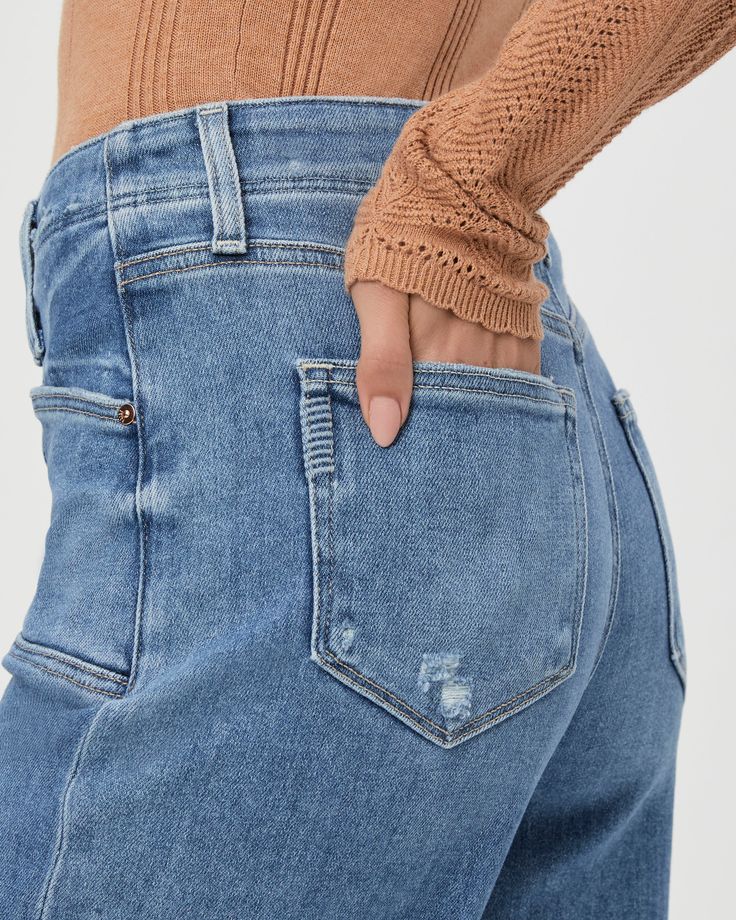 This ultra high-waisted wide leg has an easy, relaxed fit and an ankle length silhouette. This pair is crafted from our PAIGE VINTAGE denim in the perfect light wash with lived-in distressing, natural fading, set in front pockets, double belt loops and a raw hem. PAIGE Vintage takes all of the work out of breaking in your favorite pair of vintage jeans. We've combined the comfort of stretch with everything you love about authentic vintage denim to create super soft jeans that feel perfectly lived-in from the very first wear. Double Belt, Soft Jeans, Breaking In, In Distress, Vintage Jeans, Work Out, Vintage Denim, Ankle Length, Leg Jeans