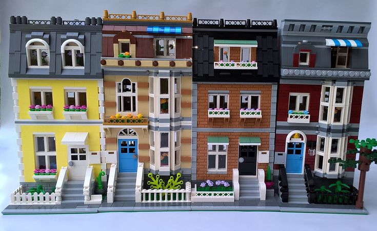 a lego model of a multi - story building with many windows and balconies