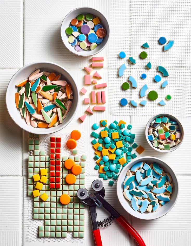 colorful candies and scissors on a white table