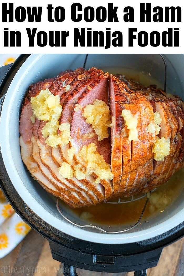 a ham in a crock pot with the title how to cook a ham in your ninja food cooker