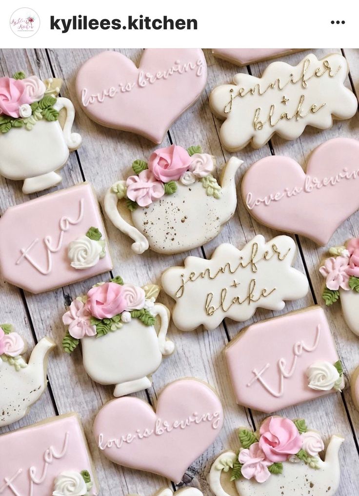 decorated cookies are arranged in the shape of teapots and hearts with names on them