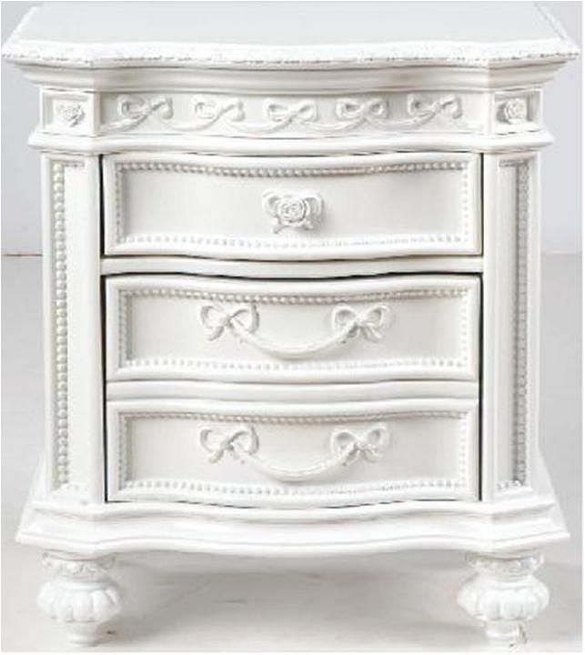 an ornate white dresser with drawers