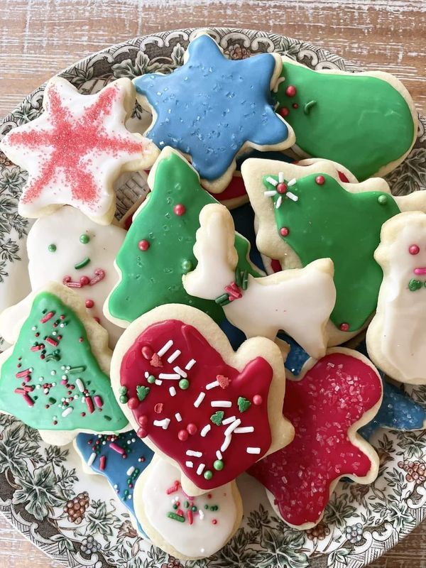 a plate full of decorated cookies on a table