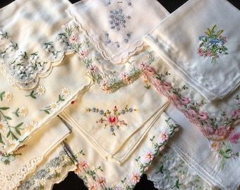 several different types of handkerchiefs laid out on top of each other, all with floral designs