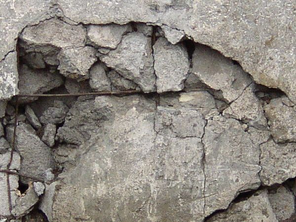 a close up of a rock with cracks in it