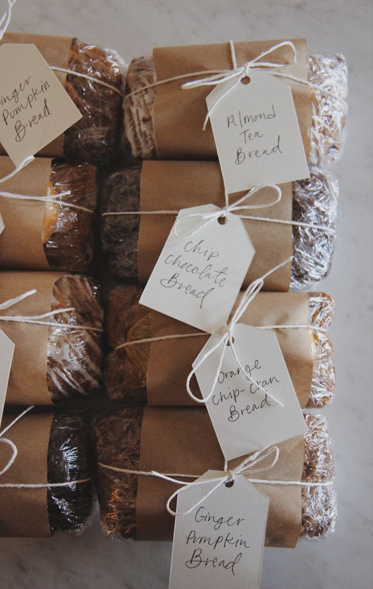 a bunch of brownies wrapped in paper and tied with twine on top of each other