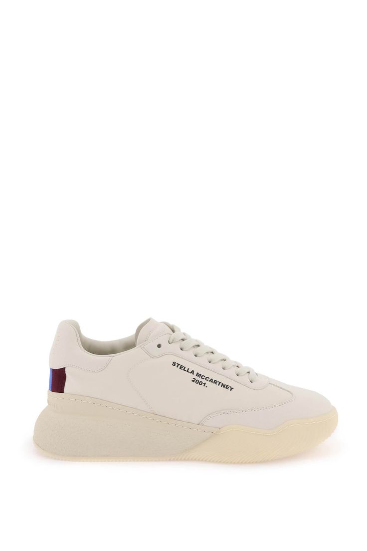 "Loop" sneakers by Stella McCartney crafted in techno fabric with faux suede insets. Lace-up closure, contrasting lettering logo on the side, terry cloth and faux leather interior with removable insole and rear gros grain detail on the heel. Rubber sole. Size Info IT Color Detail White Made In Italy Material 44% REC PL 28% PU 28% PA Season One fall Season Two winter Product shoes Brand Stella McCartney Size And Fit Heel Height = 4 cm Sporty Leather Platform Sneakers With Logo, Sporty Leather Platform Sneakers With Logo Detail, Leather Platform Sneakers With Logo For Streetwear, Modern Round Toe Sneakers With Logo Detail, Modern Sneakers With Logo Detail And Round Toe, Low-top Logo Print Sneakers For Athleisure, Low-top Athleisure Sneakers With Logo Print, Modern Low-top Sneakers With Logo, Modern Low-top Logo Sneakers