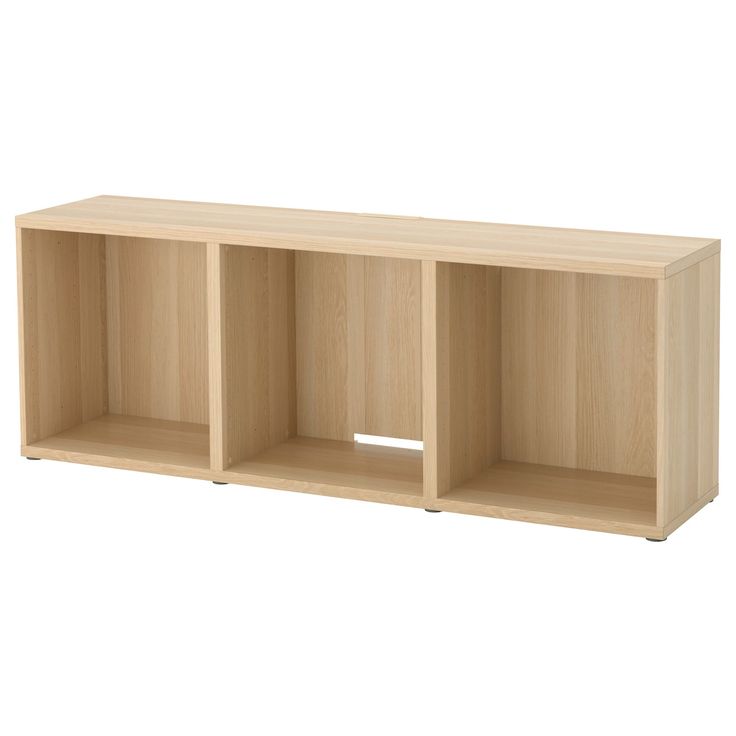 an empty wooden shelf with three compartments