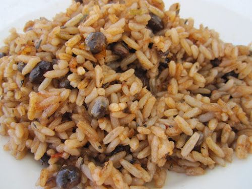 a white plate topped with rice and beans