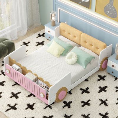 a child's bed with pink, yellow and white furniture in a bedroom setting