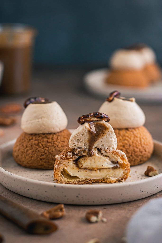 three desserts are sitting on a plate with spoons