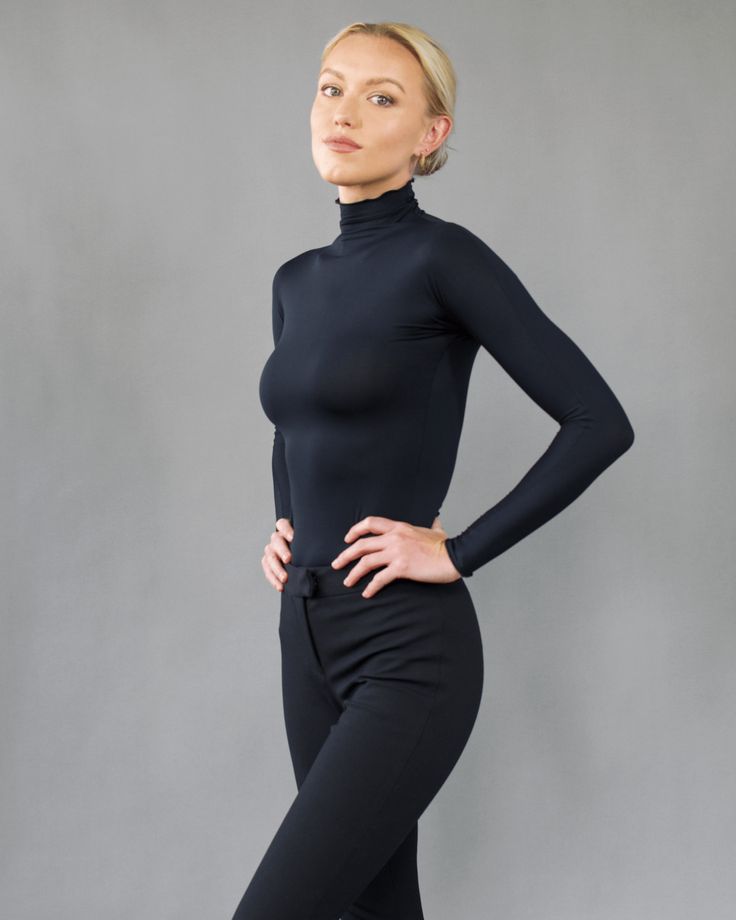 Long Sleeve Turtleneck Black Fitted Solid Color Technical Activewear, Fitted Technical Activewear, Sleek Fitted Top With Seamless Construction, Classic Black Tops, Classic High Stretch Black Top, Winter Stretch Elastane Activewear, Functional Fitted High Neck Activewear, Fitted High Neck Functional Activewear, Winter Athleisure Fitted Tops