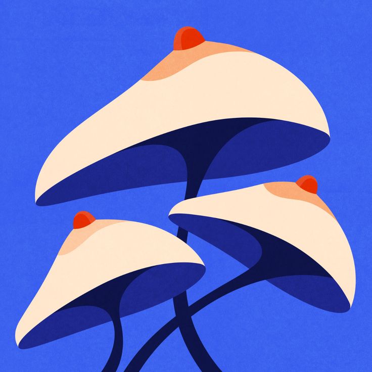 three blue and white mushrooms with red dots on their tops against a blue sky background