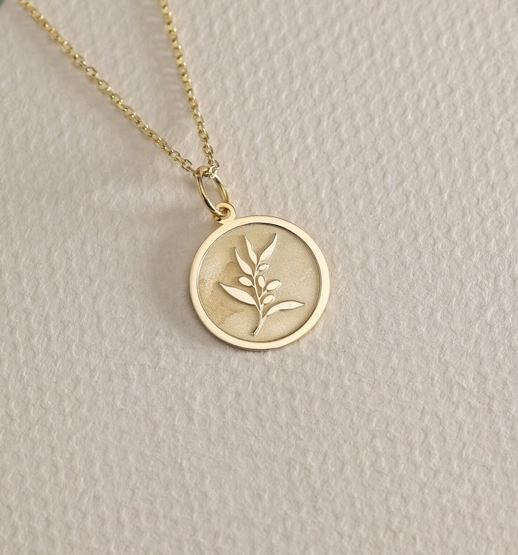 14K Real Solid Gold Olive Branch gold necklace ● Material of pendant: Solid Gold 14k ( REAL GOLD ) ● Metal Stamp: 14L ( REAL GOLD ) ● The pendant is available in 6 sizes: - 14,0 mm / 0,55 inches ( Diameter ) In the photos - 15,3 mm / 0.60 inches ( Diameter ) - 16,5 mm / 0,65 inches ( Diameter ) - 19,1 mm / 0,75 inches ( Diameter ) - 21 mm / 0,82 inches ( Diameter ) - 23 mm / 0.90 inches ( Diameter ) ( In the photos the size is 14mm / 0.55 inches Diameter ) ( Jump Ring inner diameter: 4 mm ) ● Ma Olive Branch Necklace, 14k Gold Filled Yellow Gold Charm Necklace For Anniversary, Delicate Tarnish Resistant Medallion Jewelry, Delicate Tarnish-resistant Medallion Jewelry, Delicate Yellow Gold Birth Flower Jewelry, Fine Jewelry With Birth Flower In 14k Gold, Delicate Polished Gold Jewelry, Yellow Gold Necklace With Flower Pendant For Anniversary, 14k Rose Gold Hallmarked Necklace