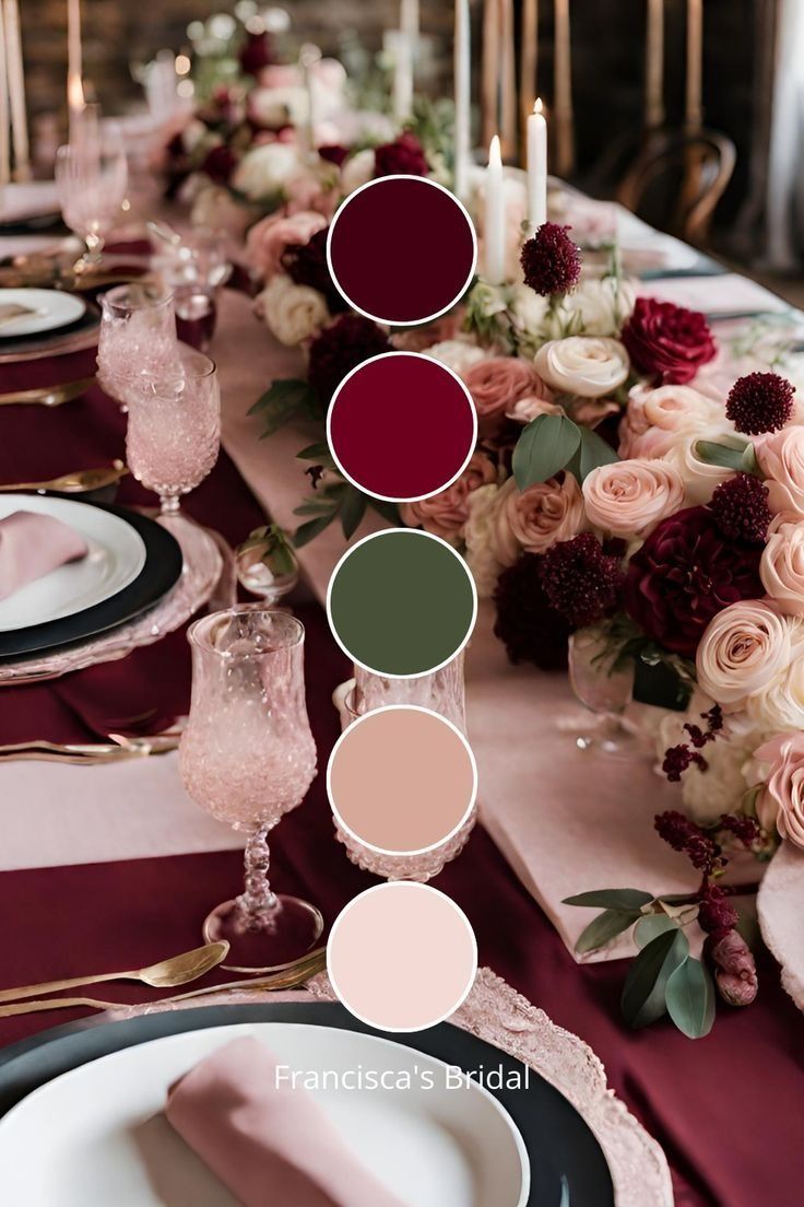 the table is set with pink and red flowers