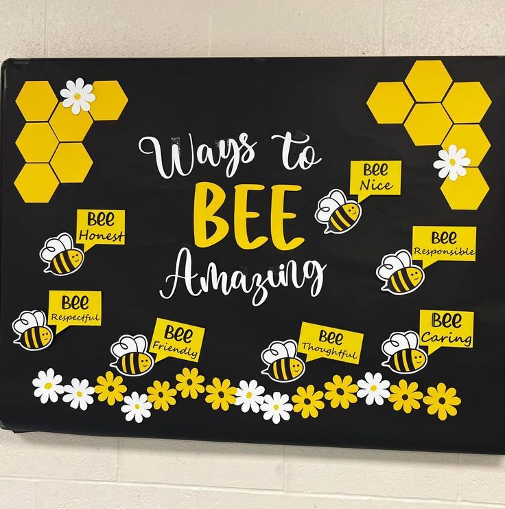 a black and yellow bulletin board with bees on it that says ways to bee amazing