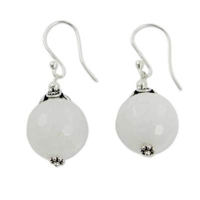 Globes of milky white chalcedony reveal subtle honeycomb facets. Narayani designs handcrafted earrings of sterling silver to showcase the lovely gems. .925 Sterling silver White Spiritual Jewelry With Matching Earrings, Elegant Chalcedony Earrings With Natural Stones, Elegant Chalcedony Drop Earrings, Chalcedony Natural Stone Drop Earrings, Chalcedony Drop Earrings With Natural Stones, Silver Faceted Chalcedony Jewelry, Faceted Silver Chalcedony Jewelry, Silver Chalcedony Jewelry, Faceted, White Chalcedony Jewelry With Natural Stones