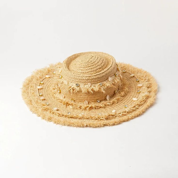 Embrace the sun while keeping cool and stylish with our Chic Raffia Sun Hat. Handcrafted from high-quality raffia, this hat is a must-have accessory for any beach goer or outdoor enthusiast looking to combine fashion with functionality. The elegant shell decoration adds a touch of seaside charm, making it a standout addition to your summer wardrobe. Key Features Sun Protection: Enjoy your day in the sun without the worry, as our hat offers excellent protection against harmful UV rays. Material: Made from 100% natural raffia, known for its durability and breathability. Design: Features a solid pattern with a casual style that complements any outfit. Seasonality: Perfect for spring and summer, providing both comfort and style in warm weather. Product Benefits Versatile Fashion: Its neutral c Bohemian Straw Hat With Short Brim For Summer, Bohemian Short Brim Straw Hat For Summer, Bohemian Summer Straw Hat With Short Brim, Straw Boater Hat With Short Brim For Beach, Wide Brim Straw Boater Hat For Vacation, Bohemian Straw Panama Hat For Summer, Vacation Wide Brim Straw Boater Hat, Straw Boater Hat With Flat Brim For Vacation, Beige Straw Hat With Short Brim For Beach