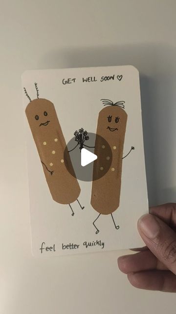 a person holding up a card with two sausages on it and the caption get well soon 9 feet better quickly