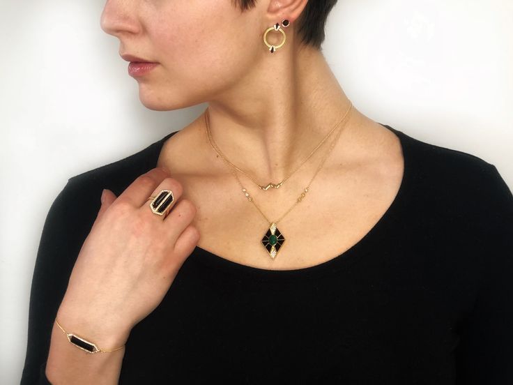 Inspired by the style and grandeur of the roaring twenties. Black onyx and diamonds are set in geometric vintage settings with delicate pavé detailing. Each jewel hearkens back to fashion's golden era. Specification: 14K Yellow Gold .05 Carat Total Weight Diamond G-H VS2-SI1 Clarity .36 Carat Black Onyx *This item is made to order. Please allow 6-8 weeks crafting time. Art Deco Evening Gemstone Jewelry, Fine Jewelry With Black Diamonds For Evening, Evening Fine Jewelry With Black Diamonds, Fine Jewelry With Black Diamonds And Onyx, Fine Jewelry Onyx With Black Diamonds, Art Deco Evening Jewelry With Jewels, Elegant Onyx Jewelry With Diamond Accents, Modern Yellow Gold Jewelry With Black Diamonds, Art Deco Jewelry With Diamond Accents For Evening