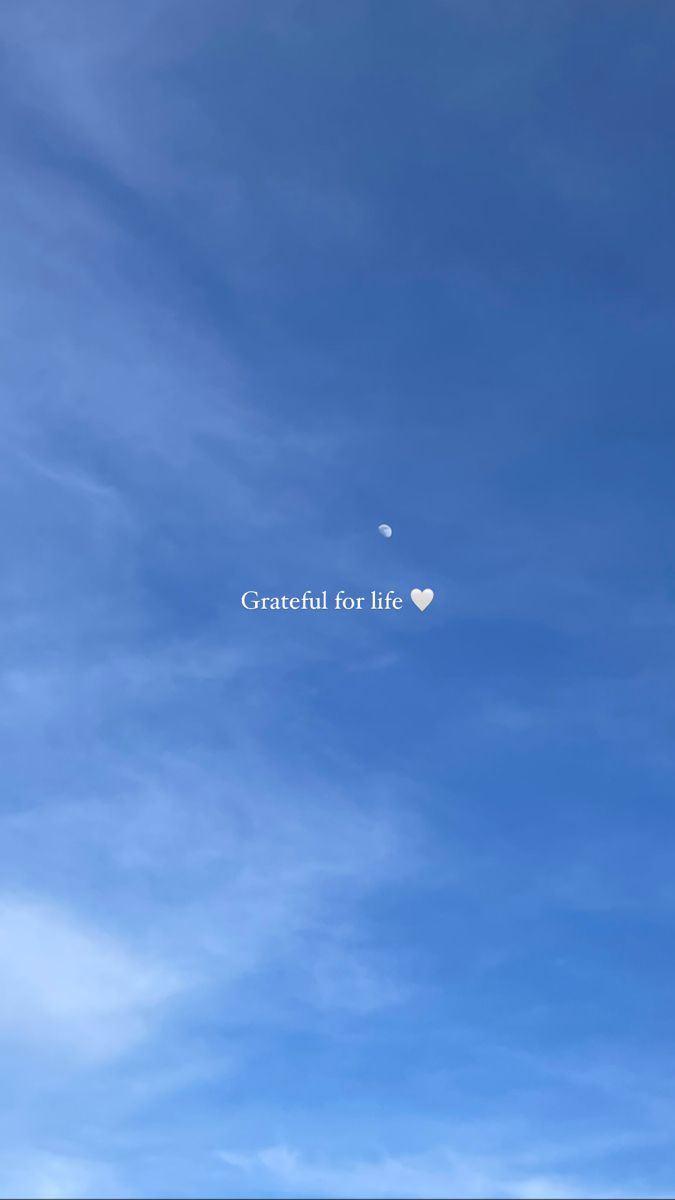 the sky is filled with clouds and there are two heart shaped balloons flying in the air