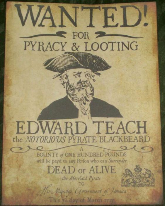 an old wanted poster is displayed on the wall