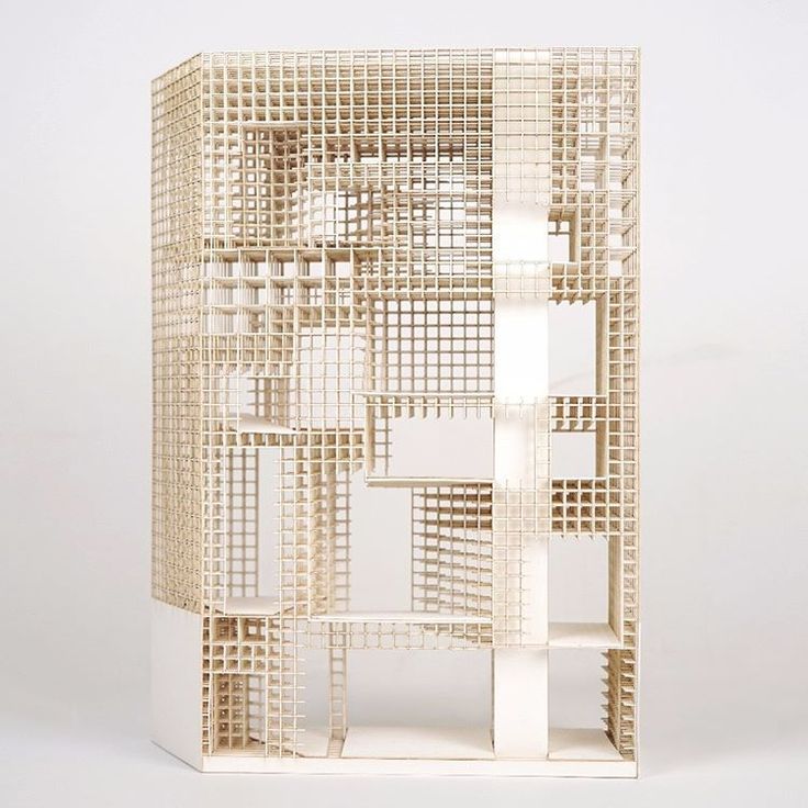 a white sculpture made out of squares and rectangles